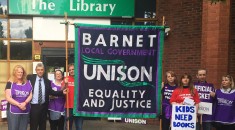General secretary Dave Prentis with striking members and the Barnet UNISON banner outside The Library, in Barnet, north London