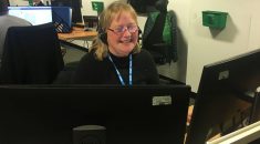 Photo of Stella Quentin at work in an NHS11 call centre