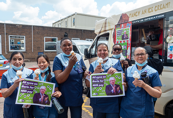 domestic services staff at Luton and Dunstable Hospital enjoy ice creams and hold 'all eyes on Boris' placards