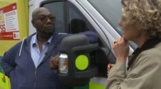 Glenn Carrington, leaning against an ambulance, talking to ITV health editor Emily Morgan