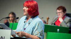 Andrea Egan speaks at rostrum