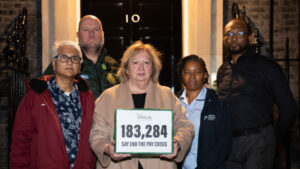 Christina McAnea holding petition box outside Downing Street with four UNISON members