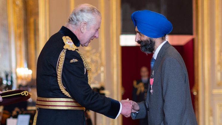 Charan Sekhon collects his MBE from King Charles at Windsor Castle
