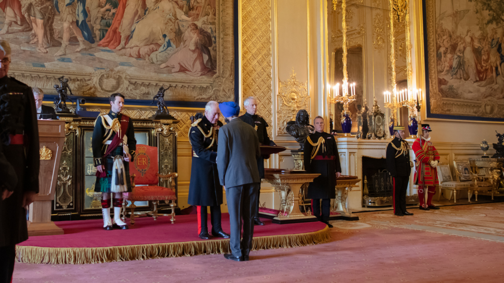 Charan Sekhon collects his MBE from King Charles at Windsor Castle