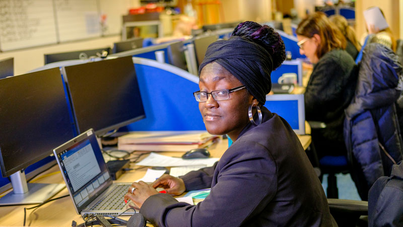 Photo of Naomi Adusa-Addai at her desk