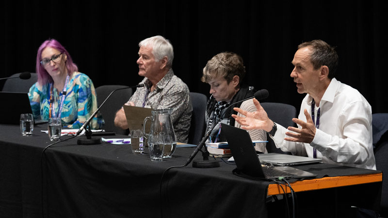 Mike Berners-Lee as one of four people sitting at a fringe top table