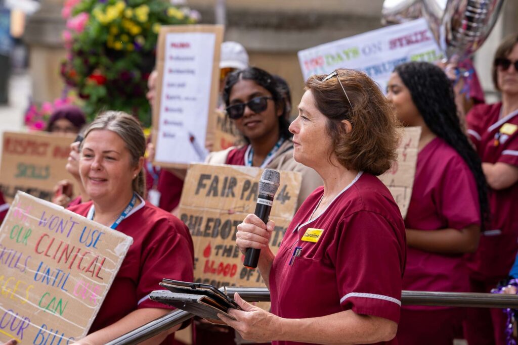 Caroline Hayhurst speaks to picketers 