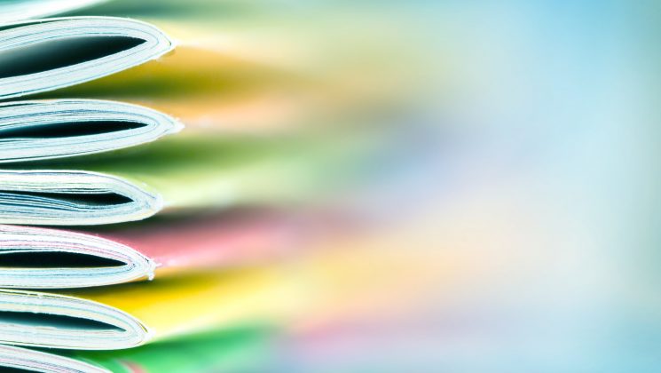 close up on different coloured spines of booklets