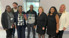 Hetticia and Vanderbilt McIntosh posing with a group of UNISON staff including Christina McAnea