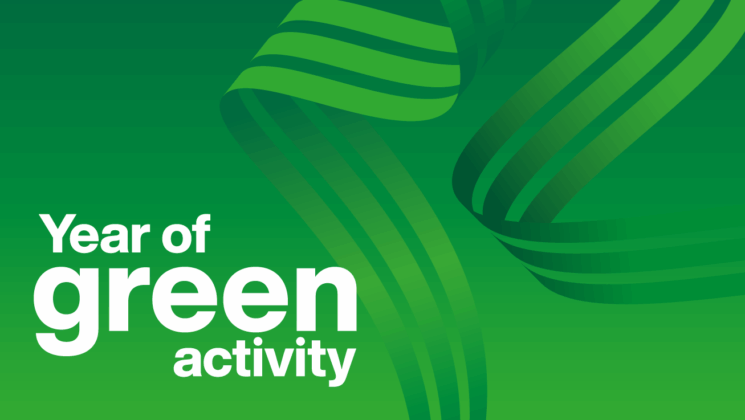 The words 'Year of Green Activity' on green background with swirls