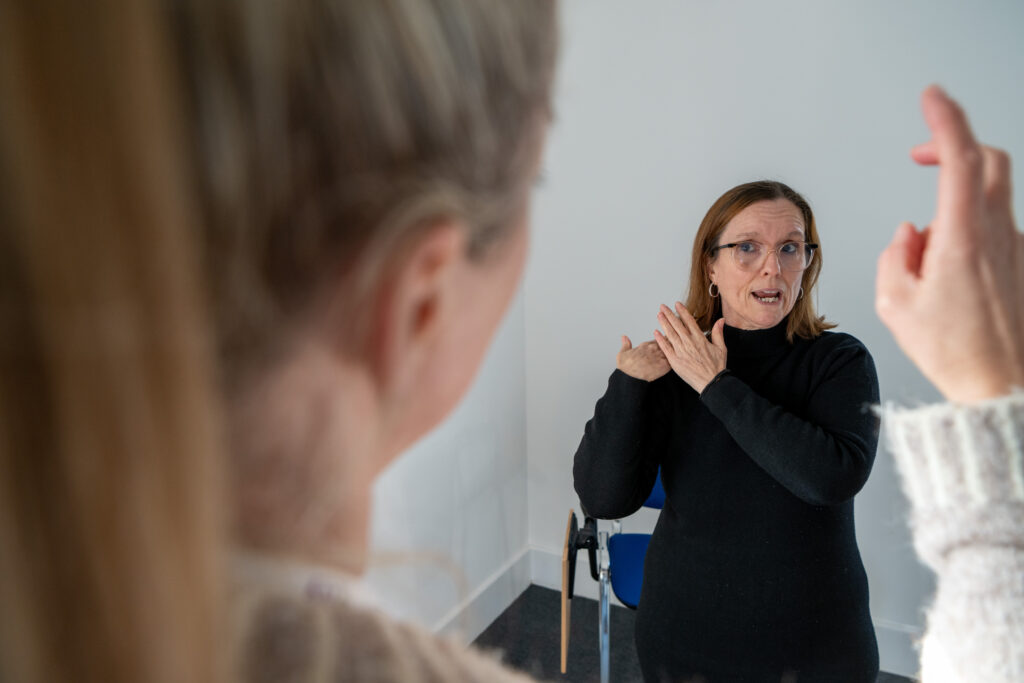 Tina Kemp talks in BSL with her interpreter Debbie