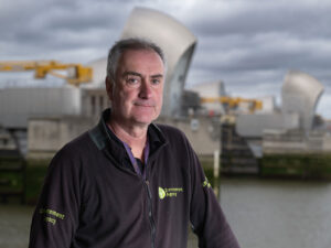 Andy Theaker with Thames Barrier behind him