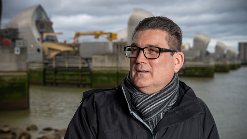 Steve Anderson, with Thames Barrier behind him